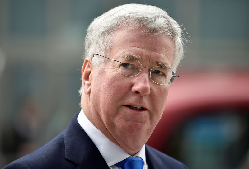 © Reuters. FILE PHOTO: British Defence Secretary Michael Fallon arrives at the National Cyber Security Centre in London