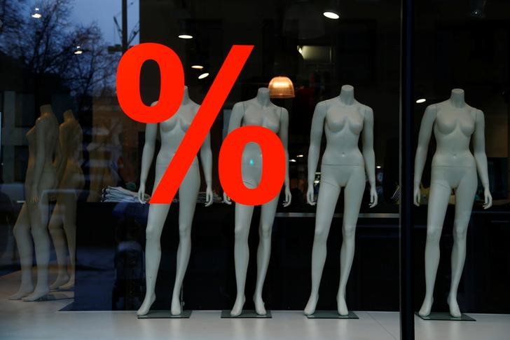 © Reuters. Discount sign is displayed in a clothing store window in Frankfurt