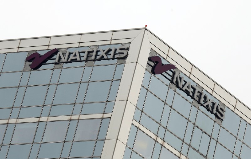 © Reuters. FILE PHOTO: The logo of French bank Natixis is seen outside of one of their offices in Paris