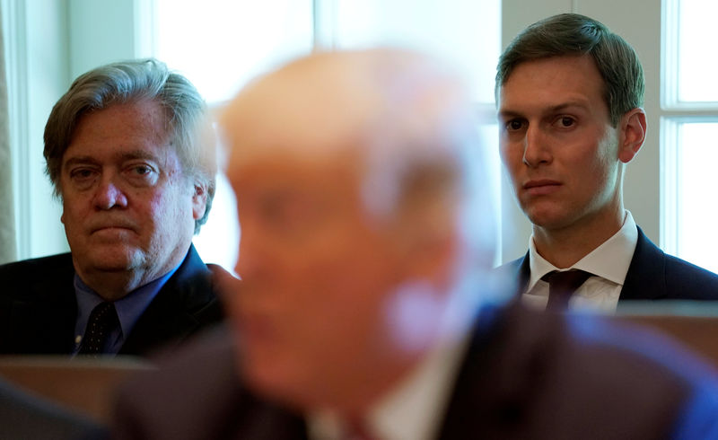 © Reuters. Trump advisers Bannon and Kushner listen as U.S. President Donald Trump meets with members of his Cabinet at the White House in Washington