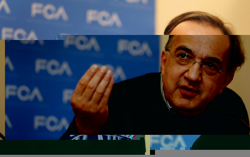 © Reuters. FILE PHOTO: Fiat Chrysler CEO Marchionne answers questions from the media during the FCA Investors Day in Auburn Hills