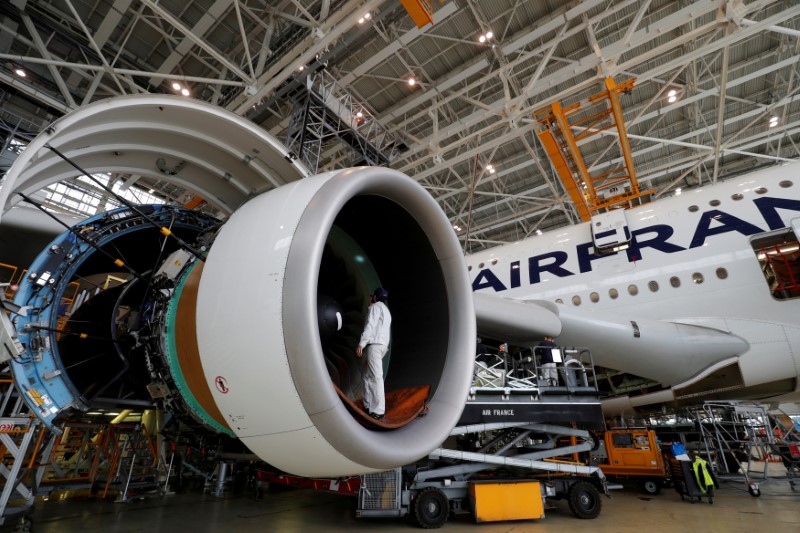 © Reuters. FILE PHOTO: FILE PHOTO: An employee works on an Airbus A380 plane inside the Air France KLM maintenance hangar at the Charles de Gaulle International Airport in Roissy