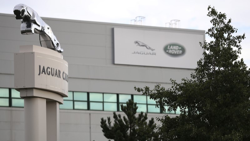 © Reuters. Signs are seen outside the Jaguar Land Rover plant at Halewood in Liverpool, northern England.