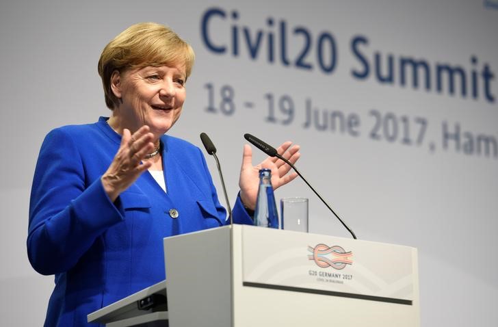 © Reuters. German Chancellor Angela Merkel addresses the Civil20 summit in Hamburg