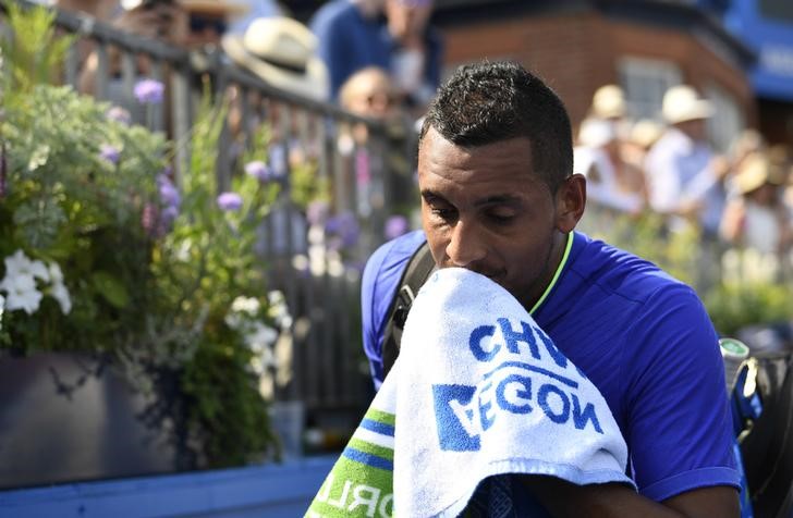 © Reuters. Australia's Nick Kyrgios looks dejected after retiring from his first round match against USA's Donald Young