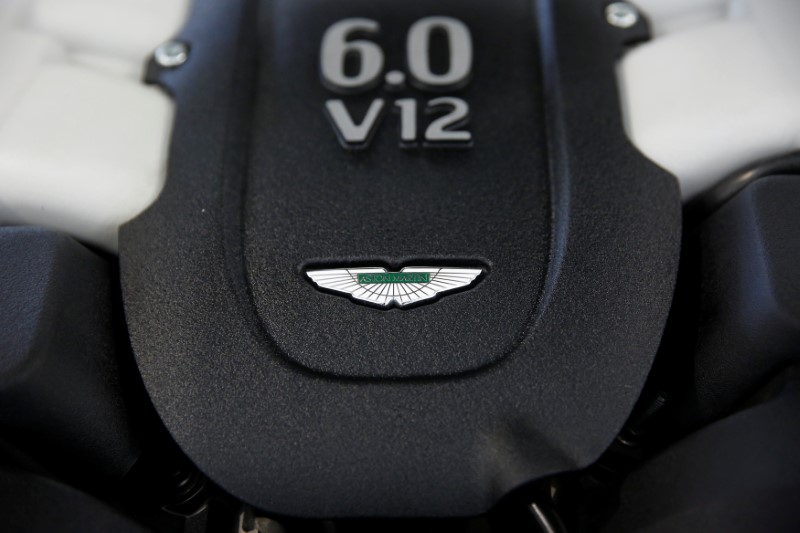 © Reuters. A picture shows the Aston Martin logo on top of an engine at a car repair workshop in Beijing