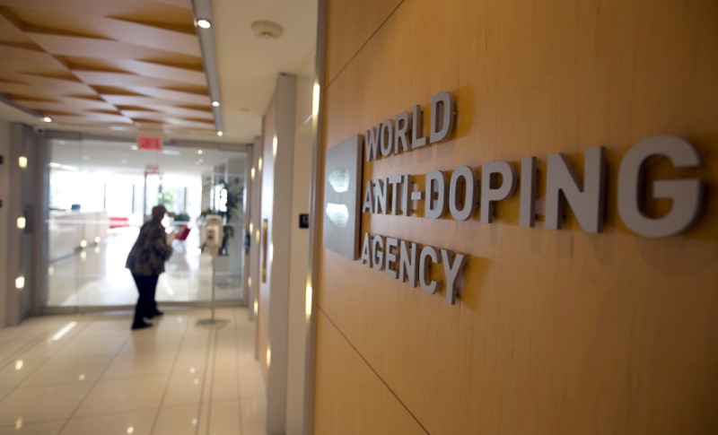 © Reuters. A woman walks into the head offices of WADA in Montreal