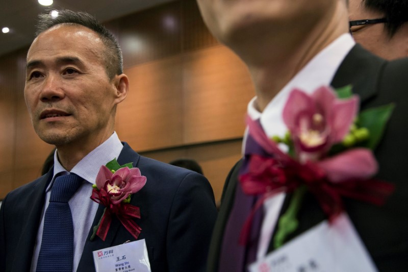 © Reuters. FILE PHOTO: Vanke's Chairman Wang Shi attends the debut of his company at the Hong Kong Stock Exchange