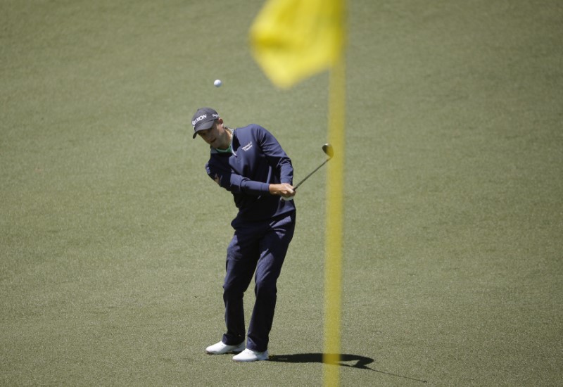 © Reuters. FILE PHOTO: Russell Knox of Scotland hits to the second green during the 2017 Masters golf tournament at Augusta National Golf Club in Augusta