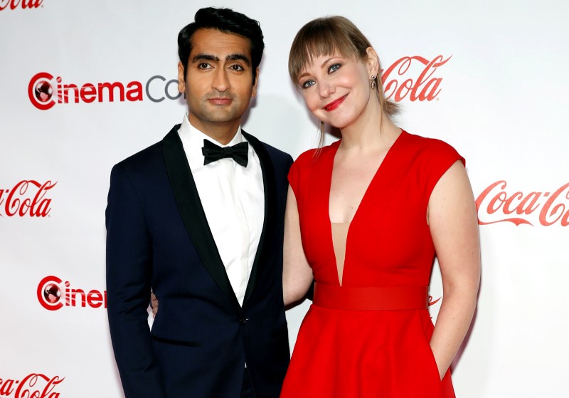 © Reuters. FILE PHOTO: Actor/comedian Kumail Nanjiani, recipient of the Comedy Star of the Year Award, and his wife writer Emily Gordon pose on the red carpet during CinemaCon, a convention of movie theater owners, in Las Vegas