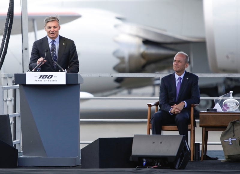 © Reuters. FILE: Ray Conner speaks as Dennis Muilenburg looks on during ceremonies marking the centennial of The Boeing Company in Seattle