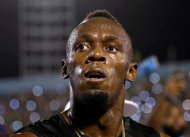 © Reuters. Jamaica's Olympic champion Usain Bolt looks up after winning his final 100 meters sprint at the 2nd Racers Grand Prix at the National Stadium in Kingston