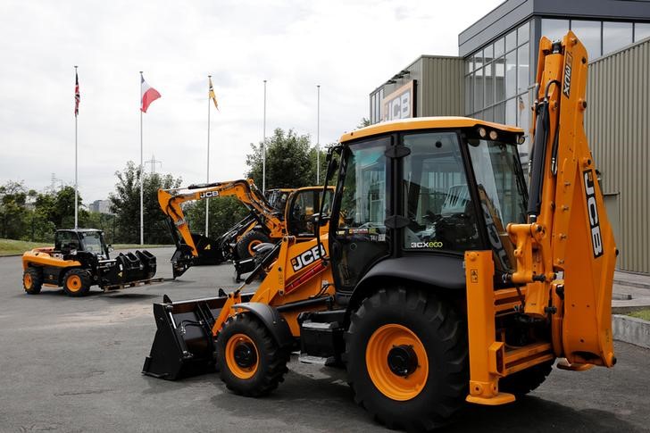 © Reuters. A telescopic handler and a backhoe loader manufactured by JC Bamford Excavators Ltd. are pictured at the JCB France headquarters in Sarcelles