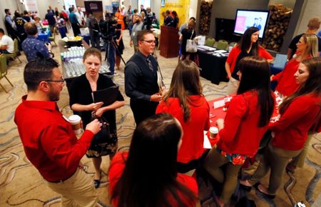 © Reuters. Target recruiters talk with job candidates at a job fair in Golden