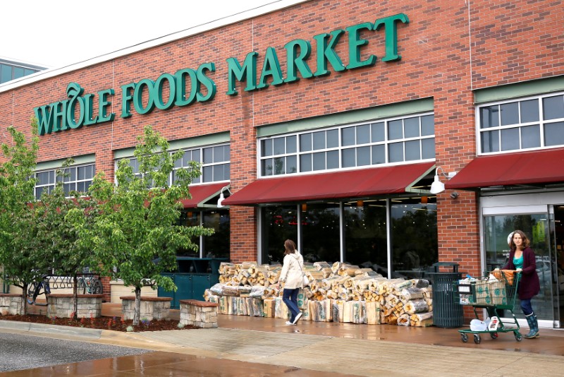 © Reuters. FILE PHOTO - Customers leave the Whole Foods Market in Boulder