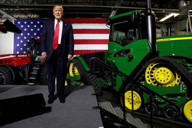 © Reuters. Farm equipment provides a backdrop as Trump takes the stage to deliver remarks on agriculture Kirkwood Community College in Cedar Rapids, Iowa