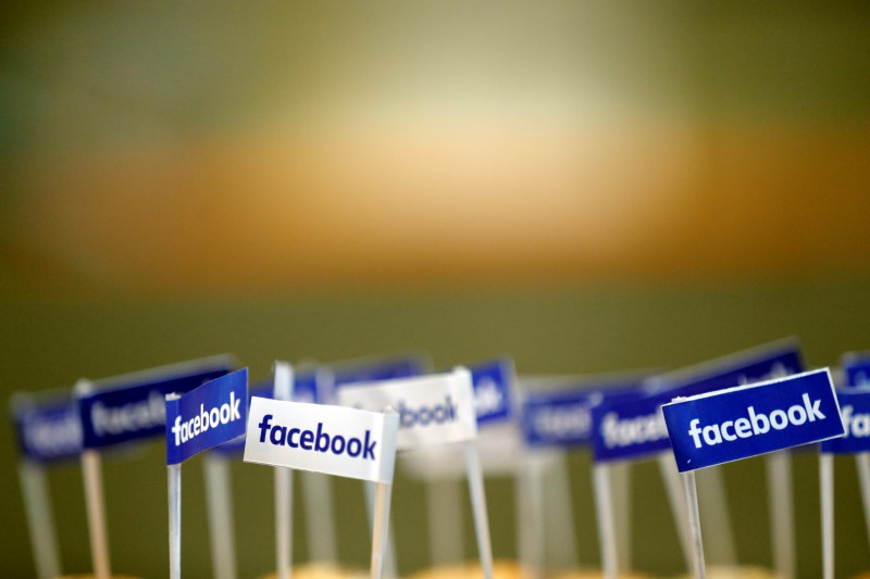 © Reuters. FILE PHOTO: Miniature Facebook banners are seen on snacks prepared for the visit by Facebook's Chief Operating Officer in Paris