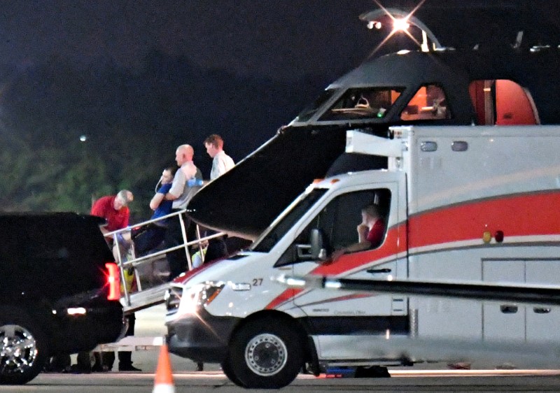 © Reuters. FILE PHOTO: A person believed to be Otto Warmbier is transferred from a medical transport airplane to an awaiting ambulance at Lunken Airport in Cincinnati