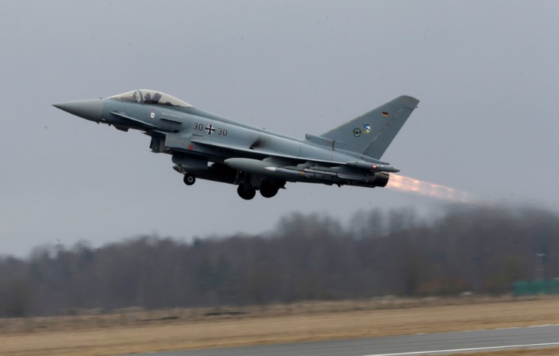 © Reuters. German Air Force Eurofighter Typhoon takes-off during the air policing scramble in Amari air base