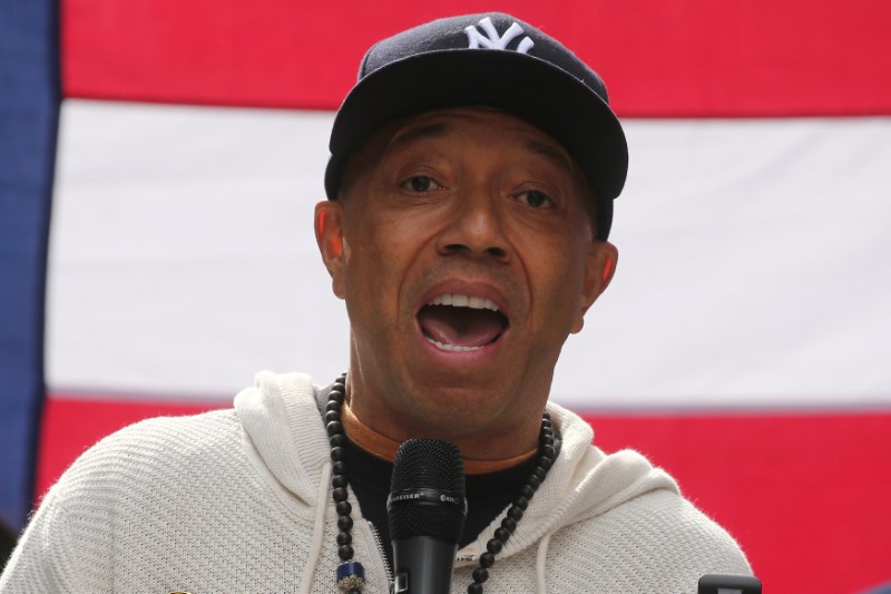 © Reuters. FILE PHOTO: Producer Russell Simmons take part in an "I am Muslim Too" rally in Times Square Manhattan, New York