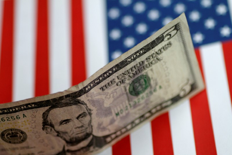 © Reuters. FILE PHOTO: Illustration photo of a U.S. five dollar note