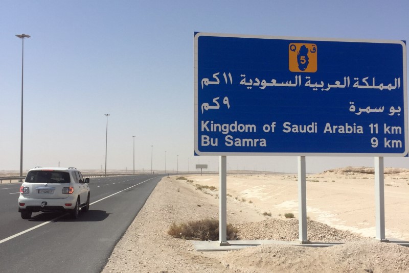 © Reuters. A road sign is seen near Abu Samra border crossing to Saudi Arabia