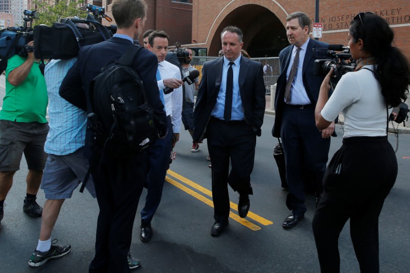 © Reuters. Pharmacist and co-founder of the now-defunct New England Compounding Center Cadden walks to his car after being sentenced to in jail in Boston