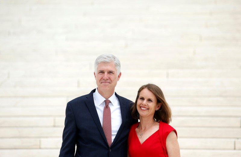 © Reuters. FILE PHOTO: Associate Justice Neil Gorsuch stands his wife Louise during his investiture  ceremony at the Supreme Court in Washington