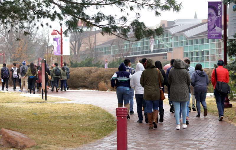 © Reuters. File photo of prospective students taking a tour at the University of Denver in Denver