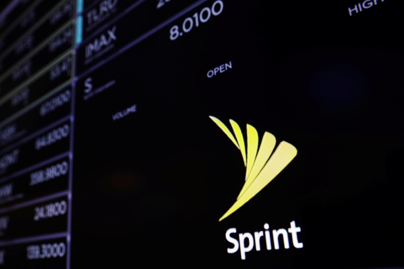 © Reuters. A screen shows a Sprint logo above the floor of the New York Stock Exchange shortly before the opening bell in New York