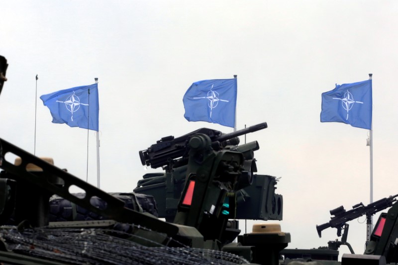 © Reuters. NATO flags flutter during the final day of NATO Saber Strike exercises in Orzysz