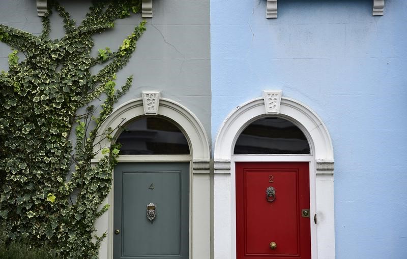 © Reuters. Painted property fronts are seen in a residential street in London, Britain.