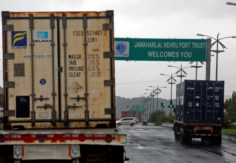 © Reuters. Trucks carrying containers enter JNPT on the outskirts of Mumbai