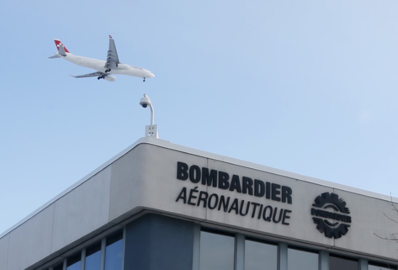 © Reuters. A plane flies over a Bombardier plant in Montreal