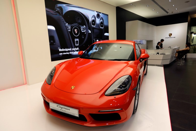 © Reuters. A Porsche Cayman is seen in a Porsche shop at Siam Paragon mall in Bangkok