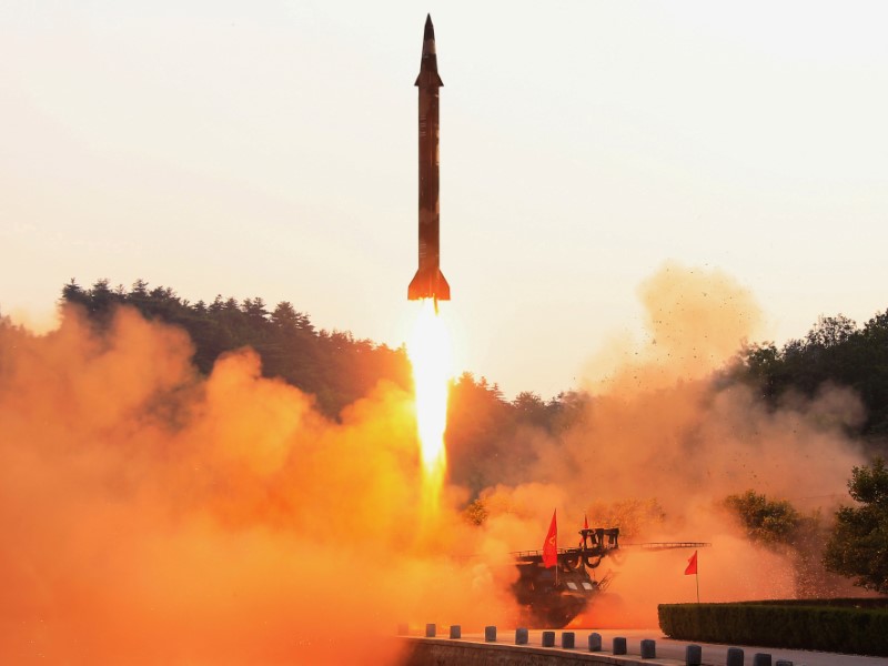 © Reuters. FILE PHOTO: A ballistic rocket is test-fired through a precision control guidance system in this undated photo released by North Korea's Korean Central News Agency