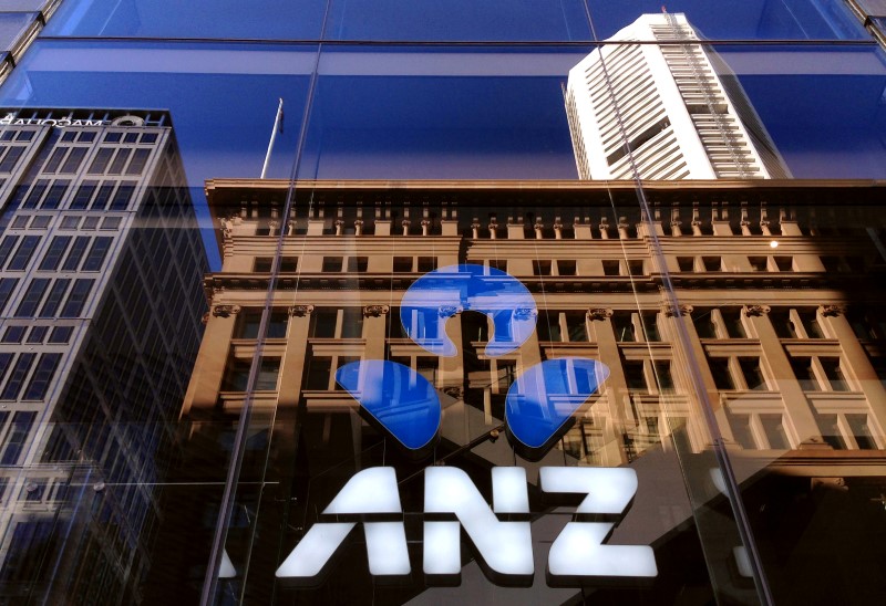 © Reuters. FILE PHOTO: The logo of the ANZ Banking Group is displayed in the window of a newly opened branch in central Sydney, Australia