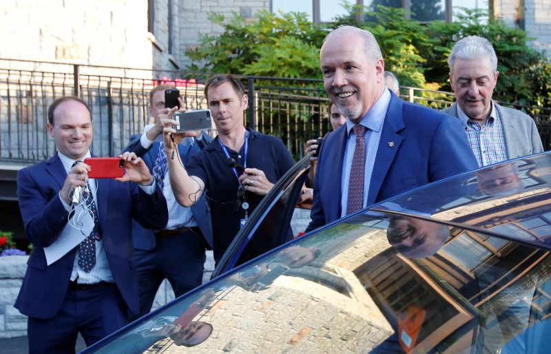 © Reuters. Premier-designate John Horgan gets into his car after making a statement to the media at Government House following a non-confidence vote in Victoria