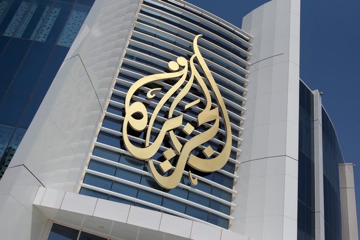 © Reuters. Al Jazeera Media Network logo at HQ in Doha