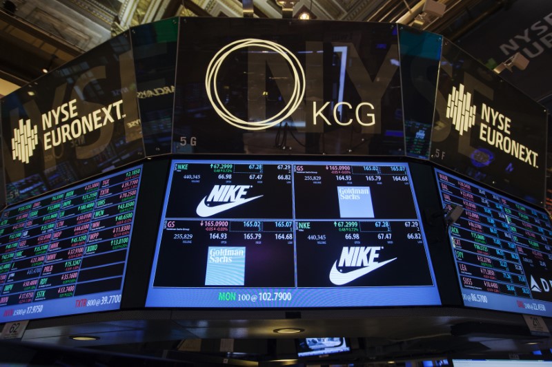 © Reuters. The Goldman Sachs and Nike corporate logos are displayed on a post above the floor of the New York Stock Exchange