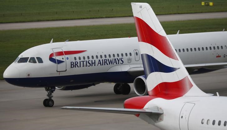 © Reuters. British Airways planes are parked at Heathrow Terminal 5 in London