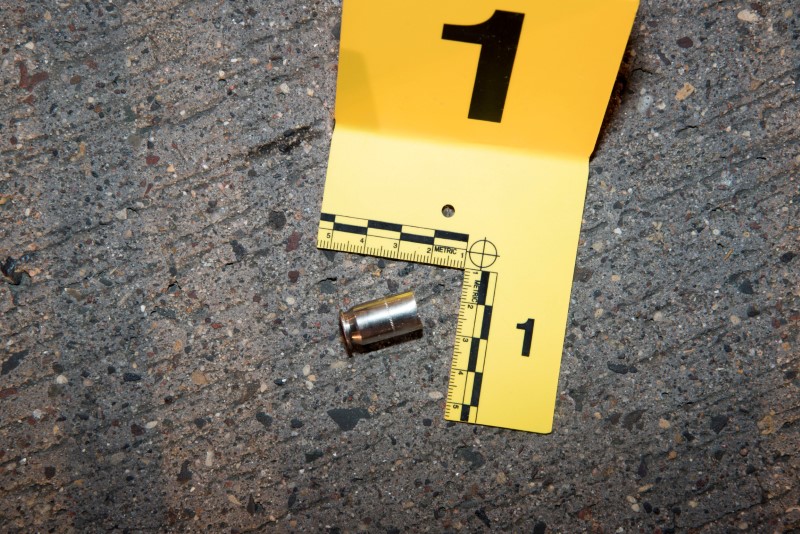 © Reuters. A shell casing from a bullet fired at Philando Castile lies outside his car