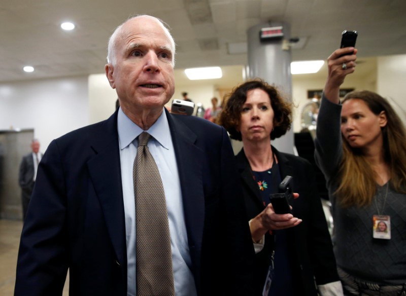 © Reuters. FILE PHOTO: Senator McCain speaks to reporters after Senate Republicans unveiled their version of legislation that would replace Obamacare in Washington