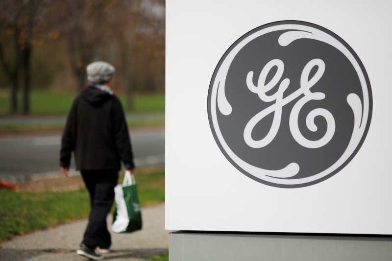 © Reuters. A pedestrian walks past a General Electric facility in Medford