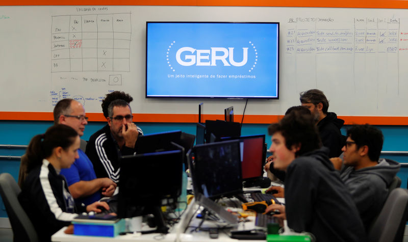 © Reuters. Employees of Brazilian financial technology firm Geru work in the company's headquarters in Sao Paulo