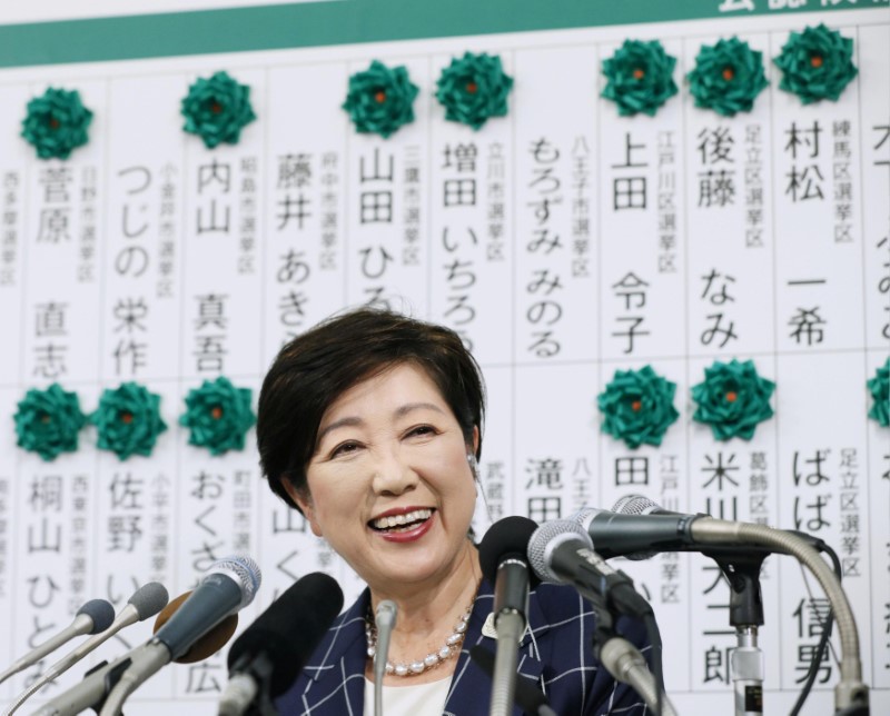 © Reuters. Tokyo Governor and head of Tokyo Citizens First party Yuriko Koike smiles at the party election results centre for Tokyo Metropolitan Assembly election in Tokyo