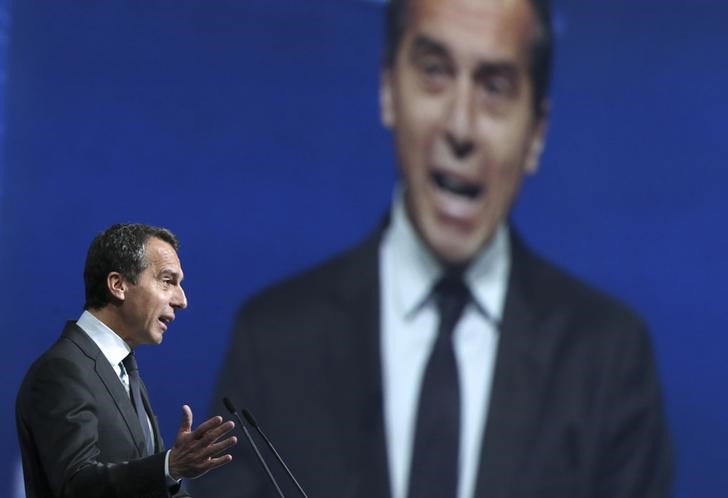 © Reuters. Austrian Chancellor Kern speaks during a session of the St. Petersburg International Economic Forum