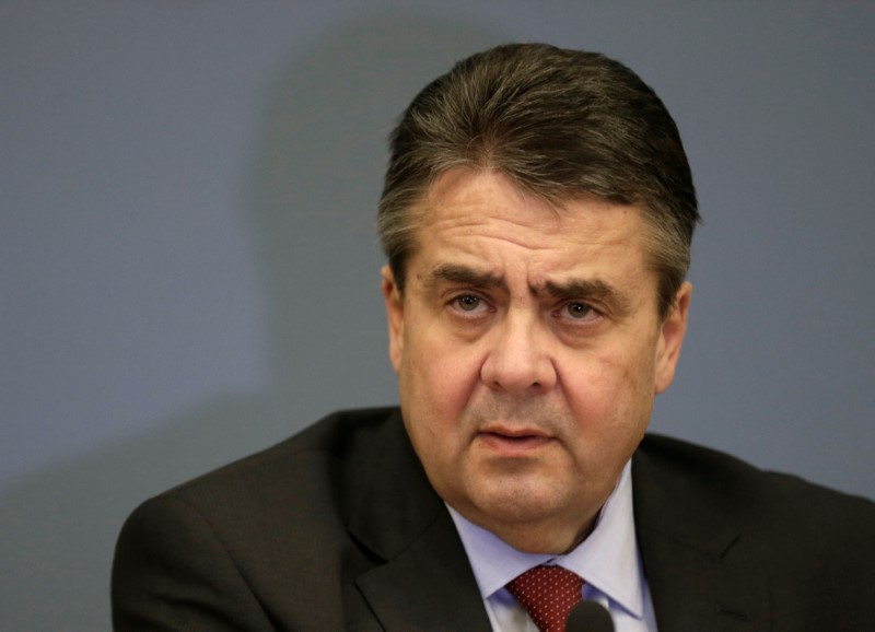 © Reuters. FILE PHOTO: German Foreign minister Sigmar Gabriel listens during a news conference in Riga, Latvia