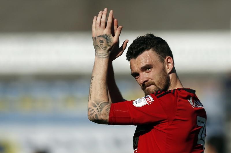 © Reuters. FILE PHOTO: Fulham’s Scott Malone celebrates at the final whistle