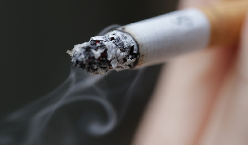 © Reuters. A woman smokes a cigarette in this illustration picture taken in Paris